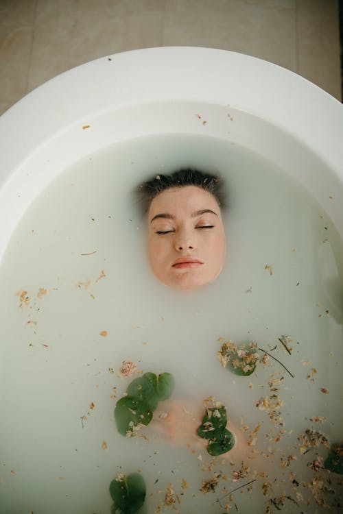 Free High-Angle Shot of a Woman in the Bathtub Stock Photo