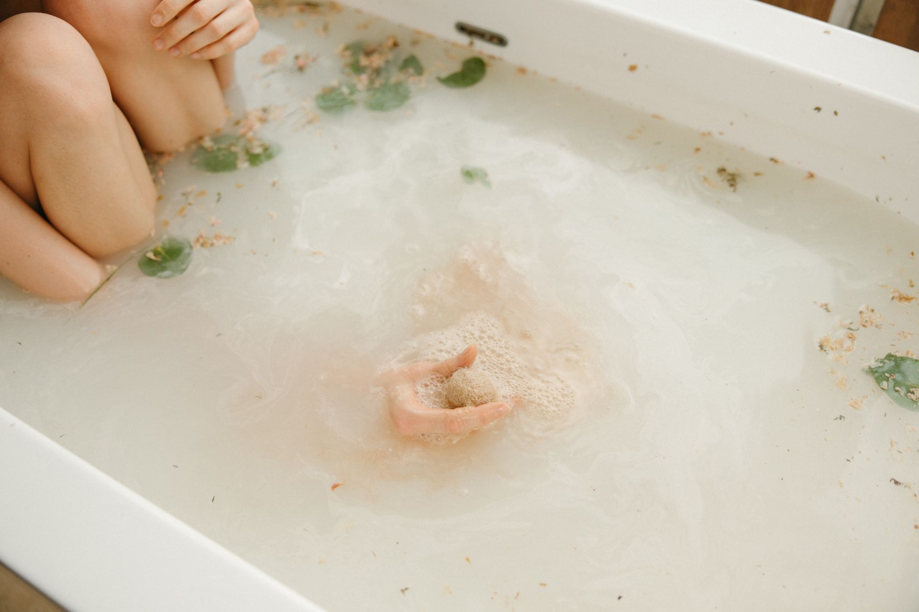 Person immersed in an ice bath, demonstrating cold therapy practice.
