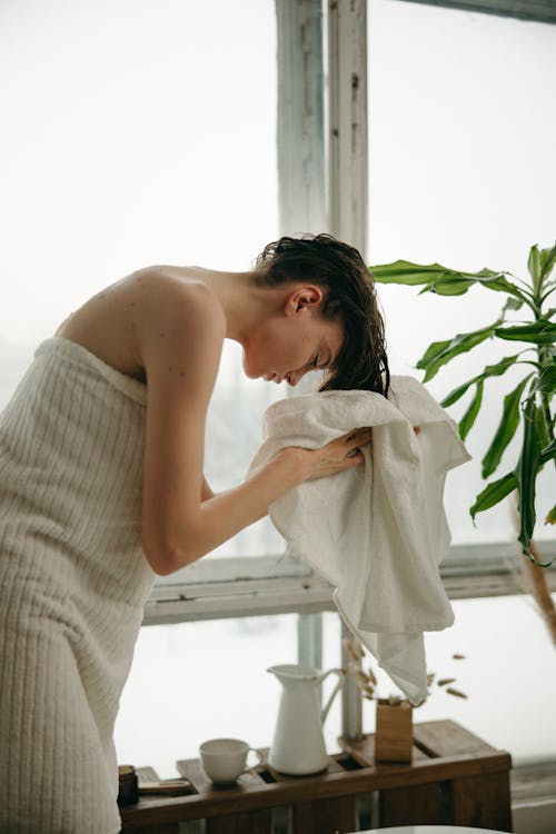 Free Person Drying Her Hair with Bath Towel Stock Photo