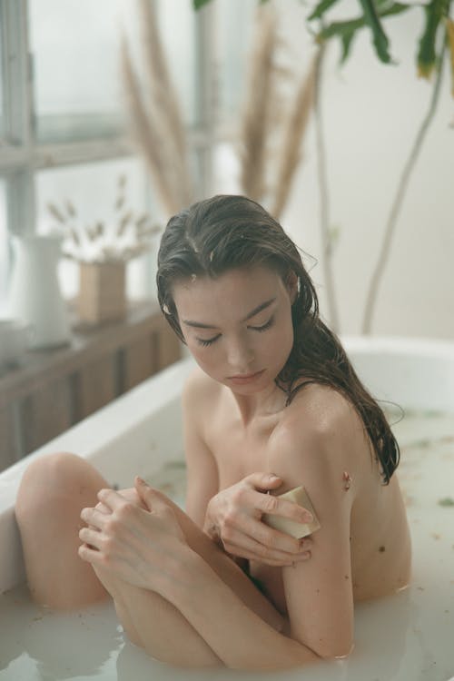 A Woman Sitting in the Bathtub