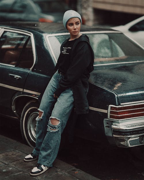 Stylish Woman Leaning on a Car