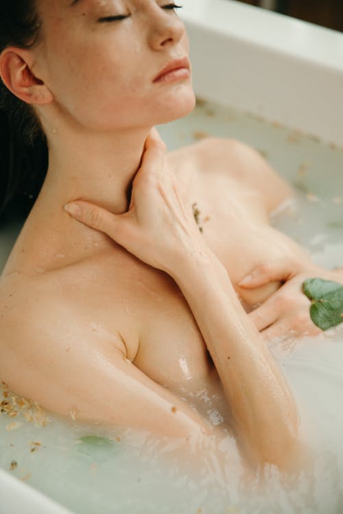 A Woman Bathing in a Bathtub