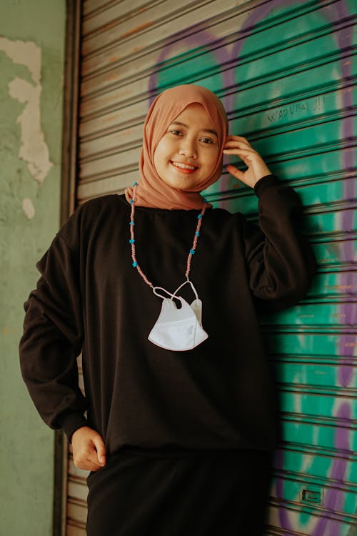 Woman in Black Sweater Wearing Hijab