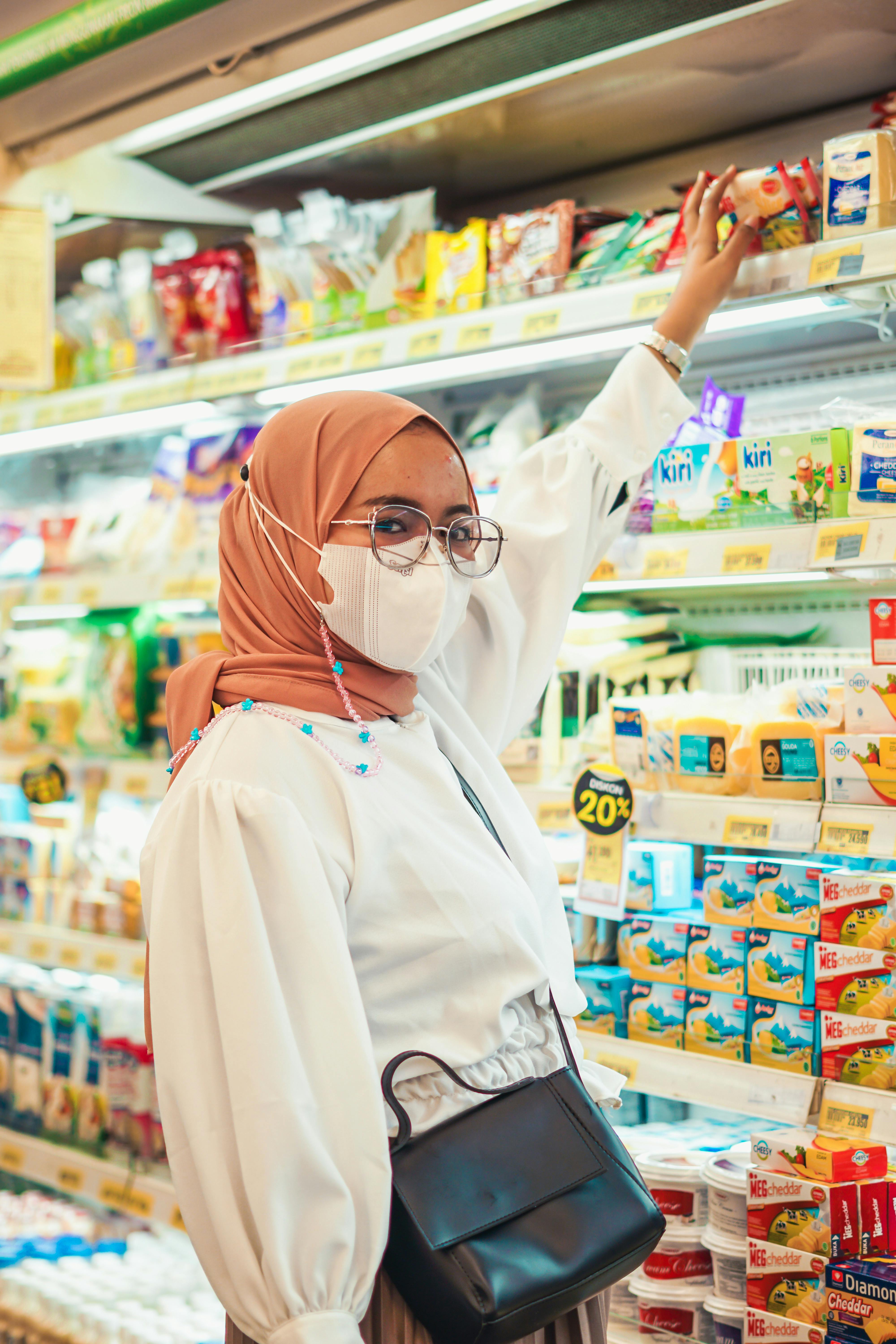Muslim Couple Buying Groceries · Free Stock Photo