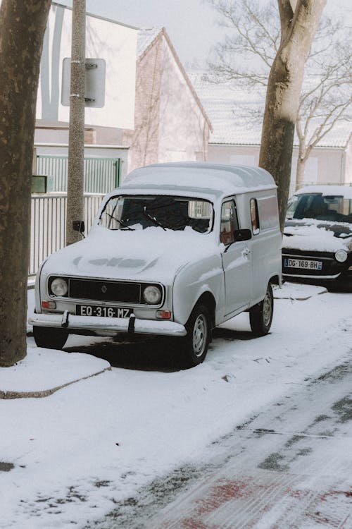 Retro car parked on snowy street