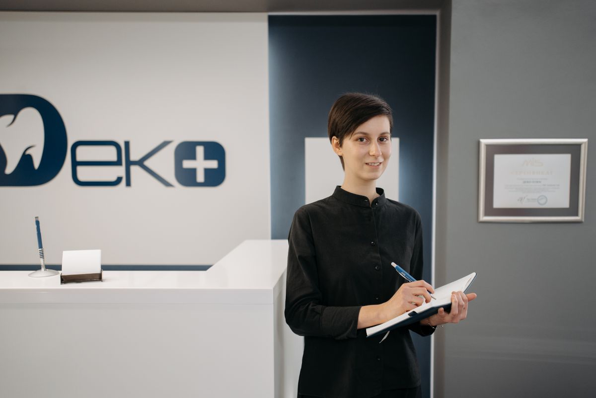 A modern clinic reception where the website chatbot books patients automatically