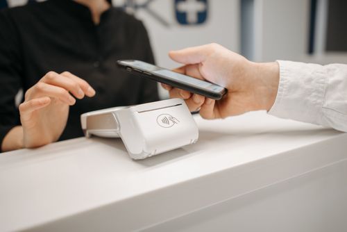 Person paying with phone app