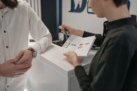 A Woman Explaining the Contents of the Brochure