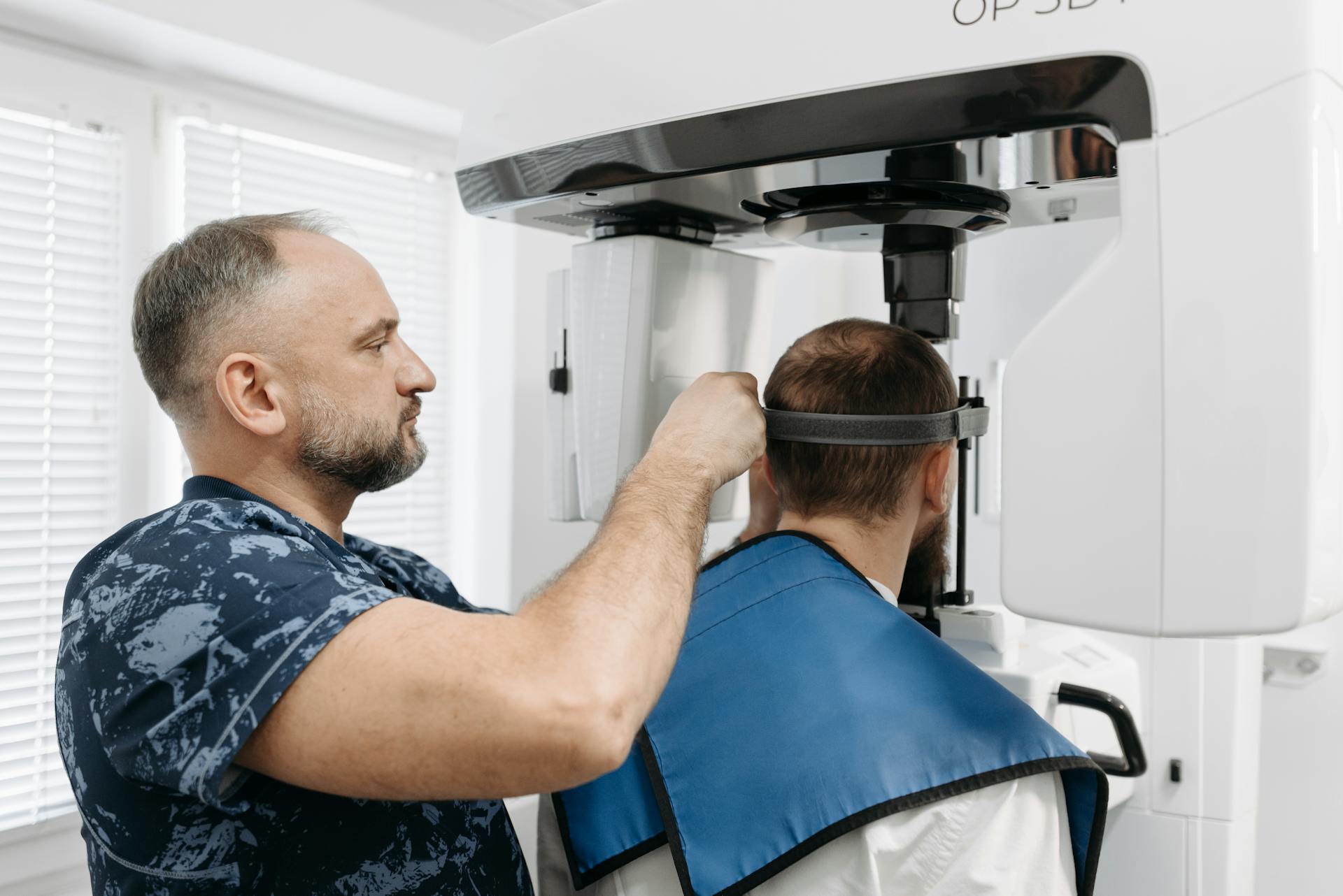 Man Preparing his Patient for a Dental X-Ray