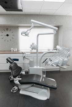 Clean and modern dental office interior with advanced equipment and dental chair.