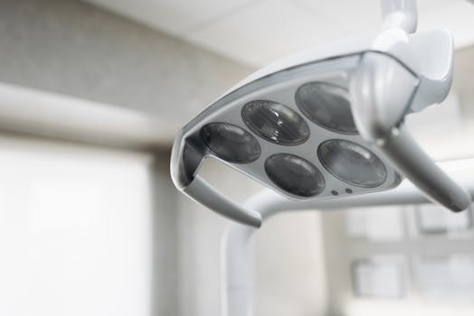 Close-up view of a modern dental operatory light inside a clinic.