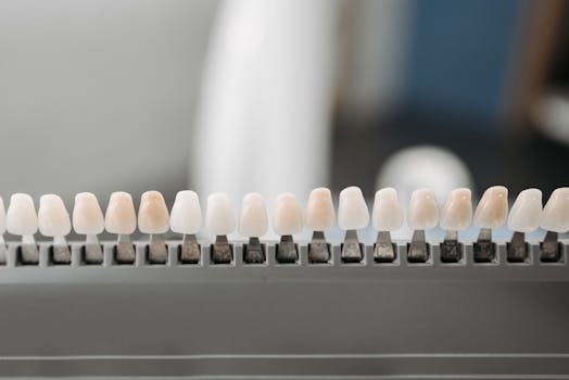 Close-up of dental veneers arranged neatly on a display rack in a dental office setting.