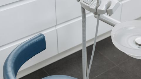 High-angle view of dental chair and equipment in a modern healthcare office.