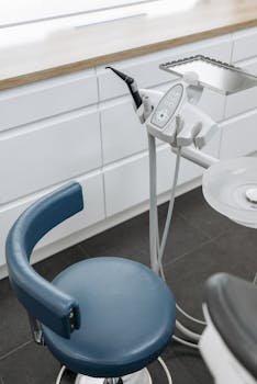 High-angle view of dental chair and equipment in a modern healthcare office.