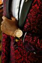 Person Wearing Gold Round Analog Watch