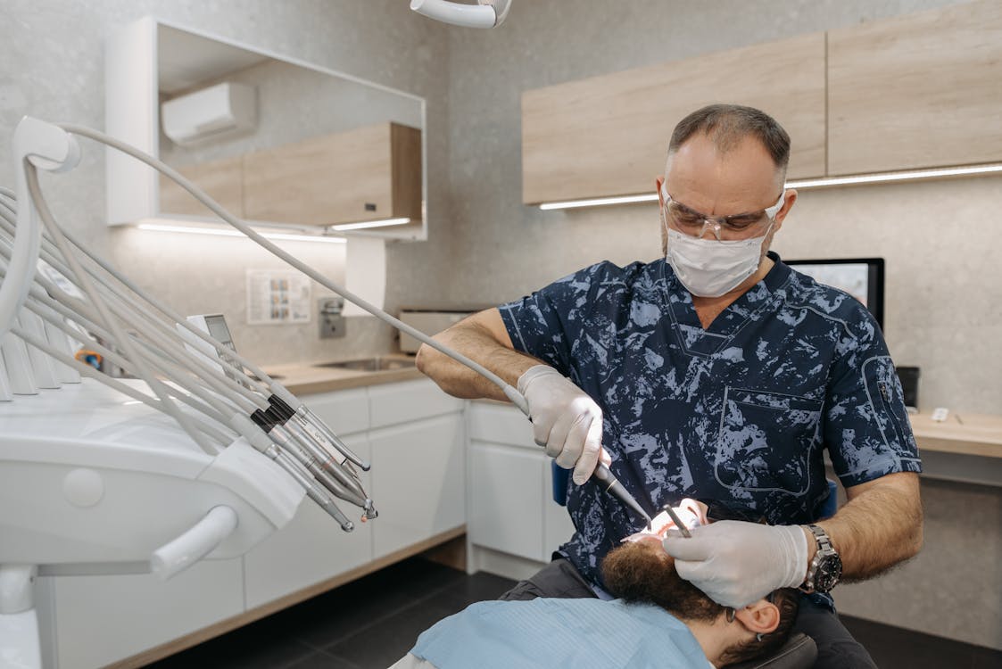 Dentist Checking on a Patient's Teeth