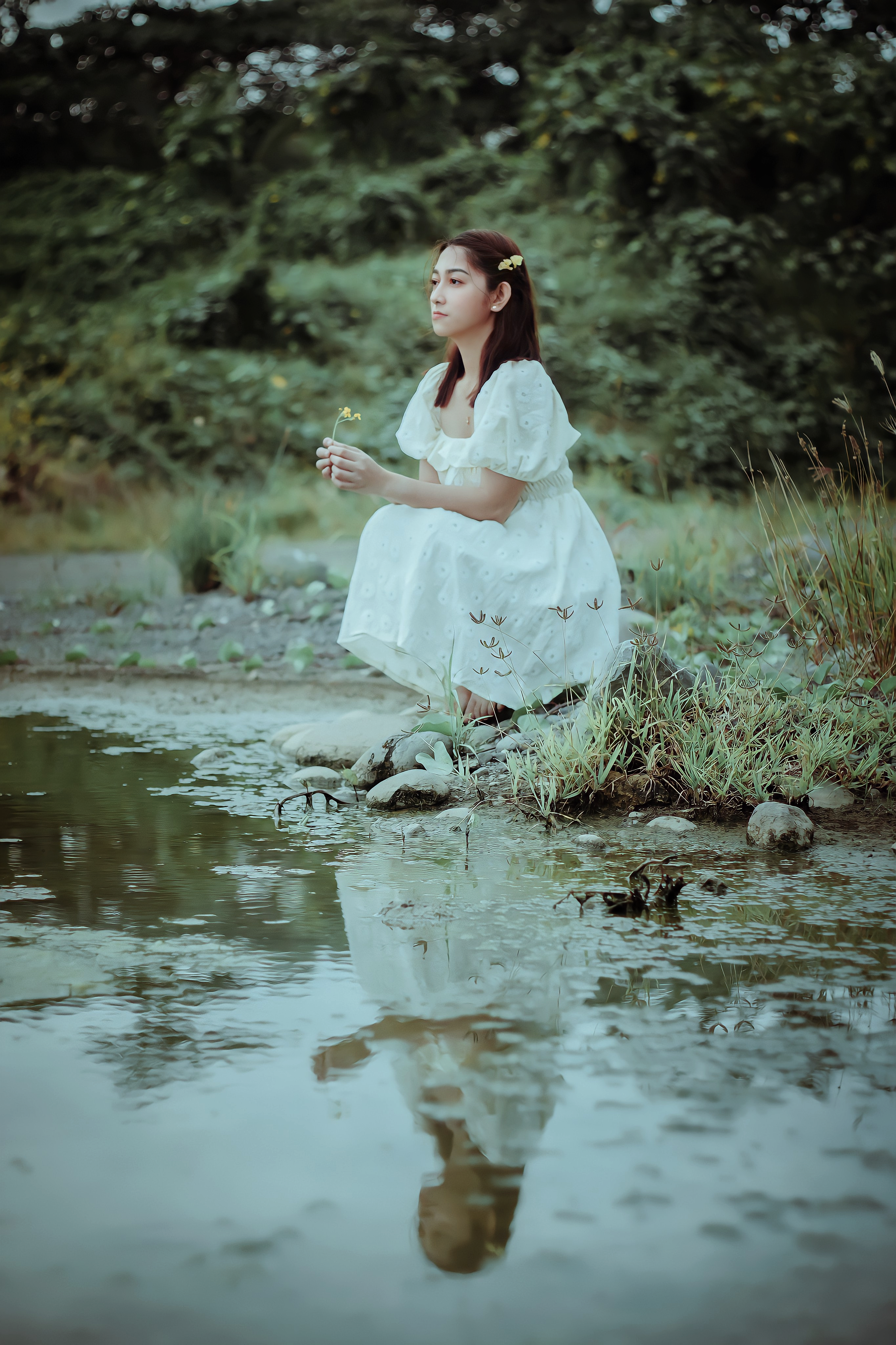 A Woman in White Dress Sitting Beside the Lake · Free Stock Photo