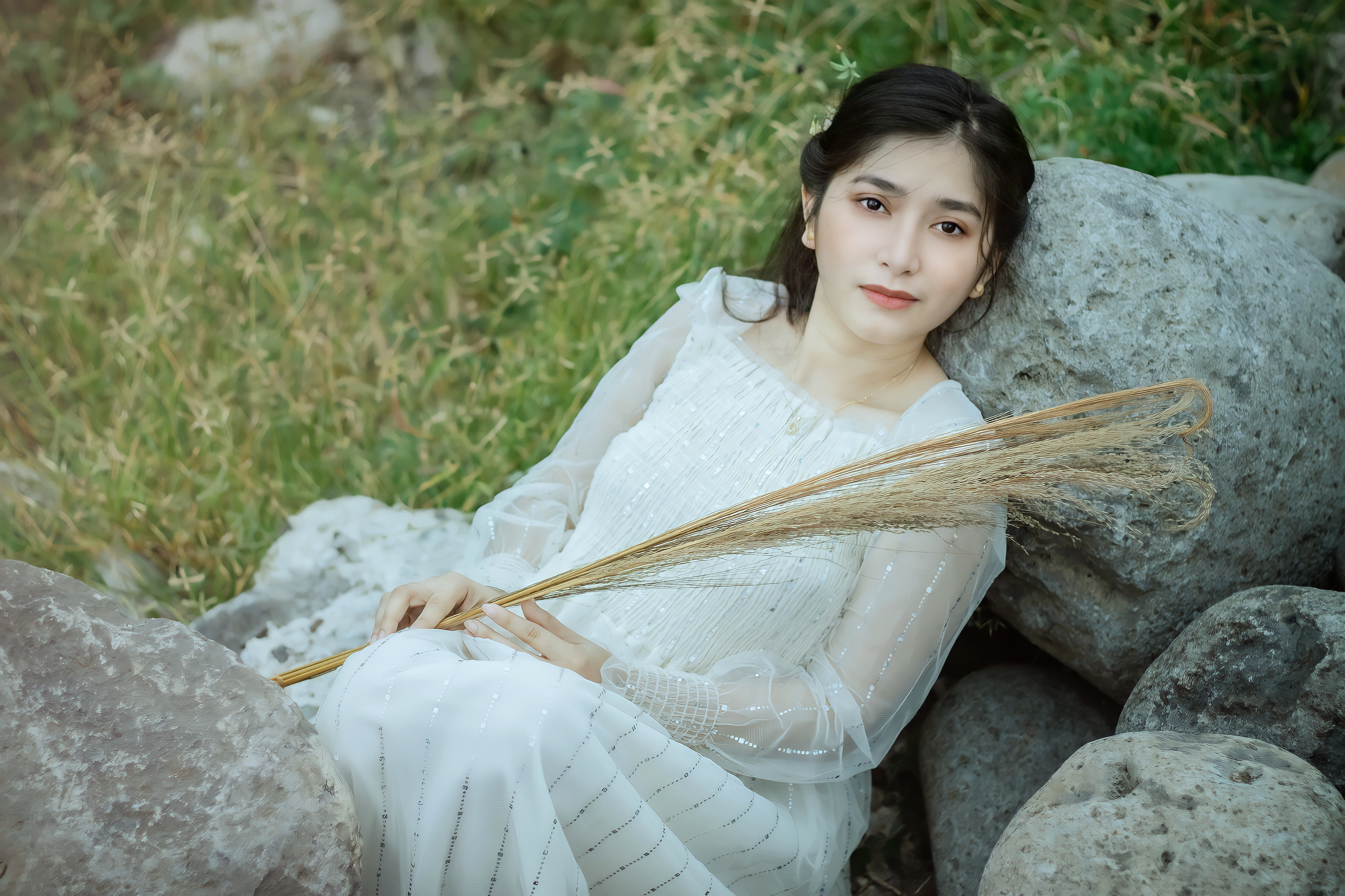 Woman in White Dress Leaning on a Rock · Free Stock Photo