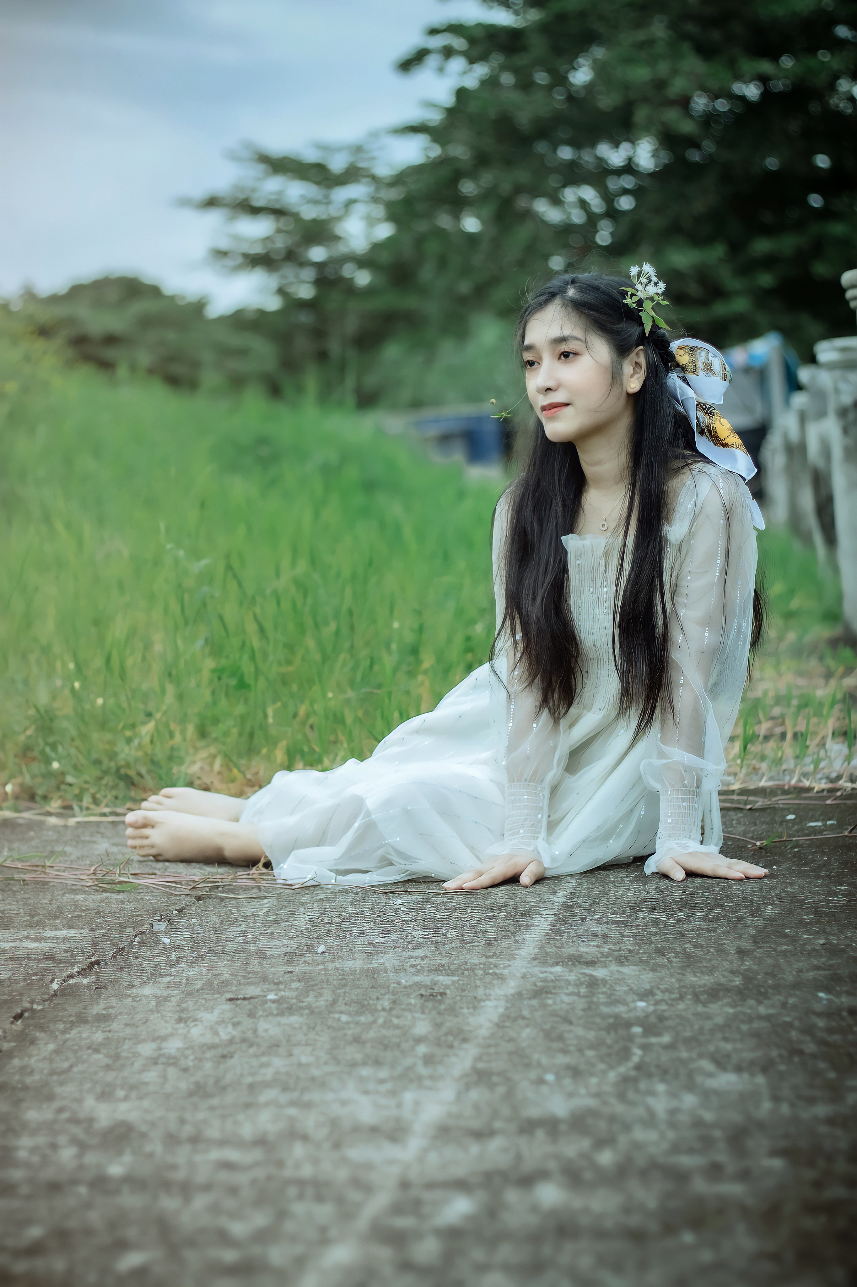 Woman in White Dress Sitting on the Ground · Free Stock Photo