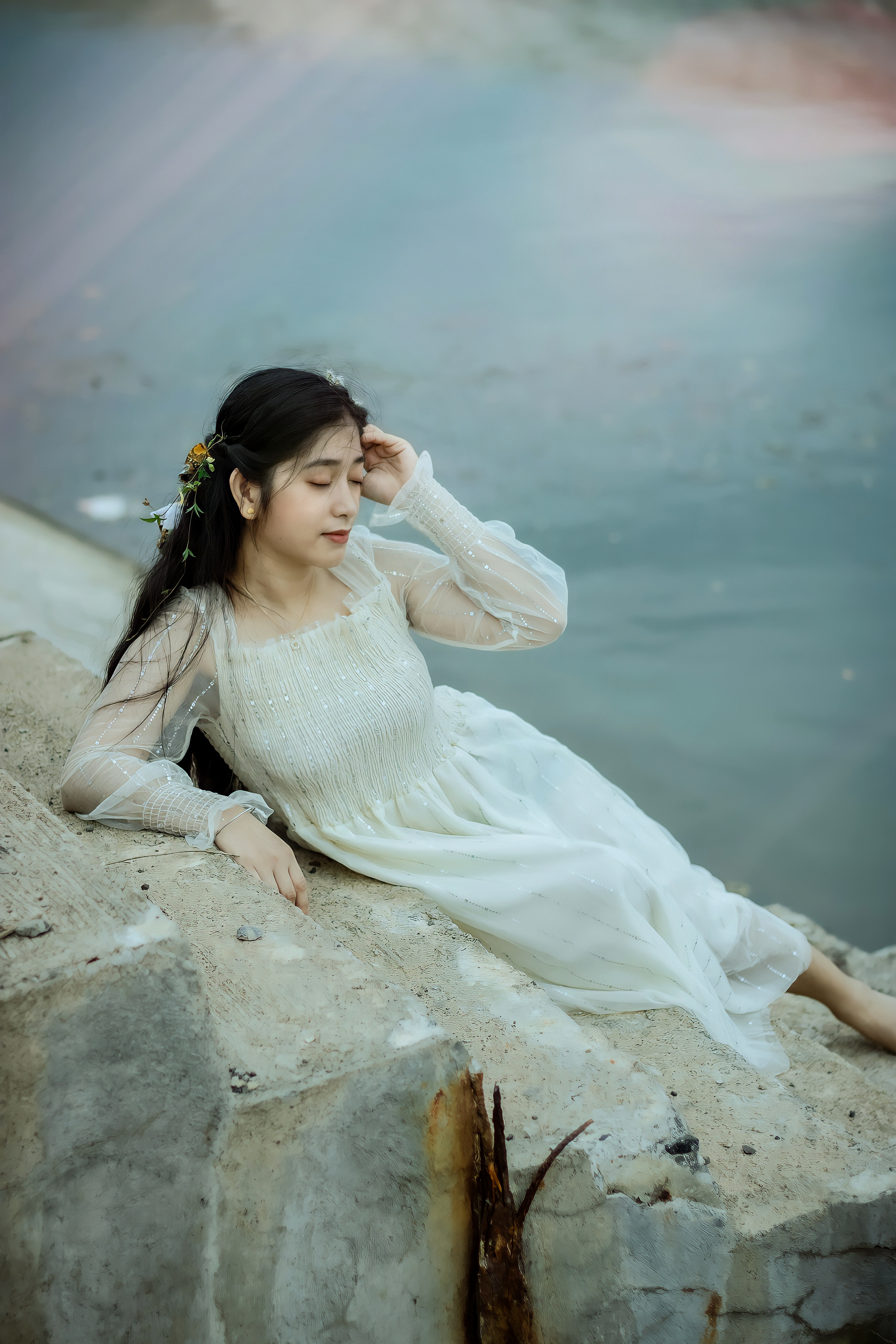 A Woman in a White Dress Posing on the Concrete Steps · Free Stock Photo
