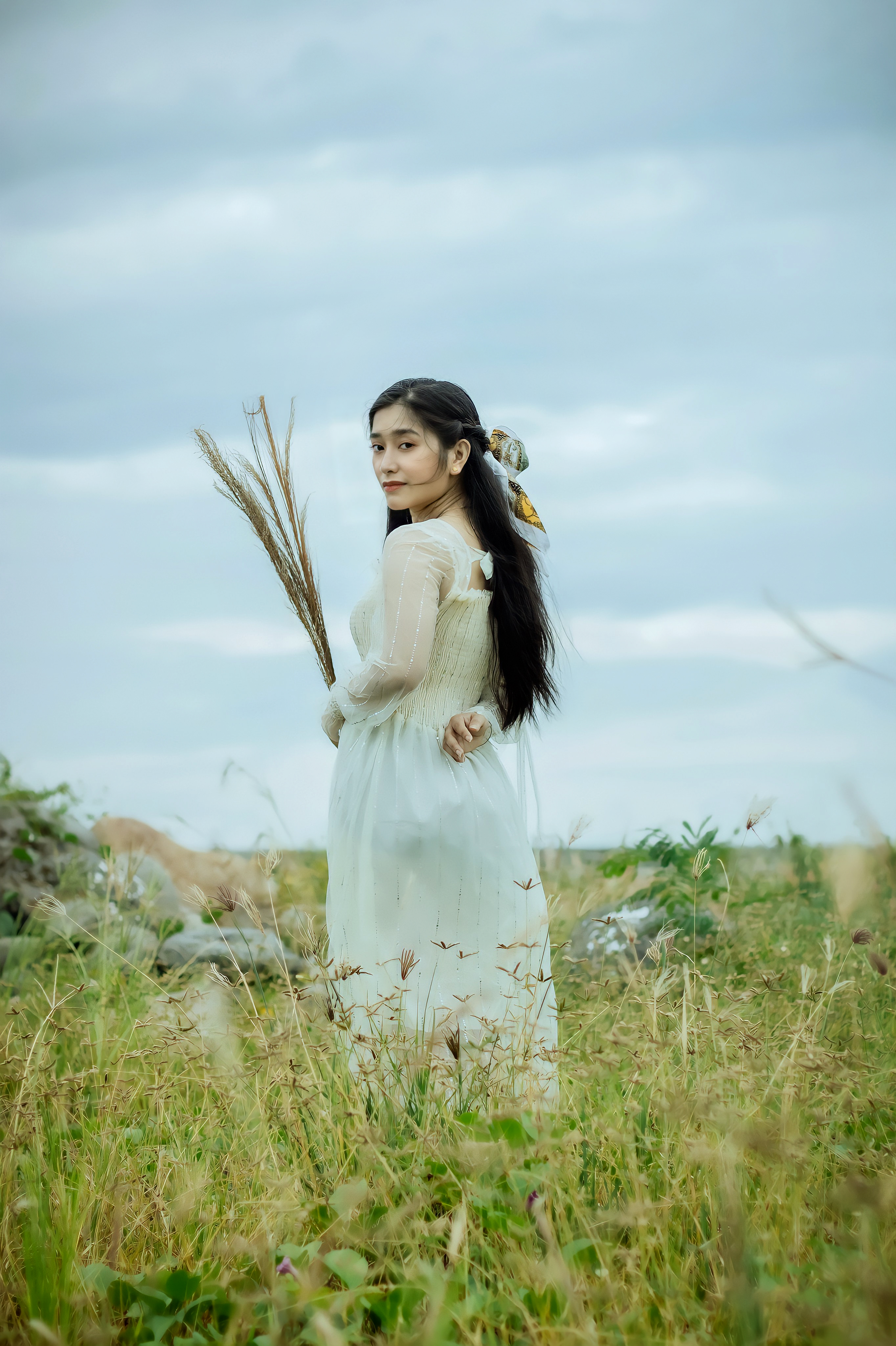 Woman in White Dress Standing on Grass Field · Free Stock Photo