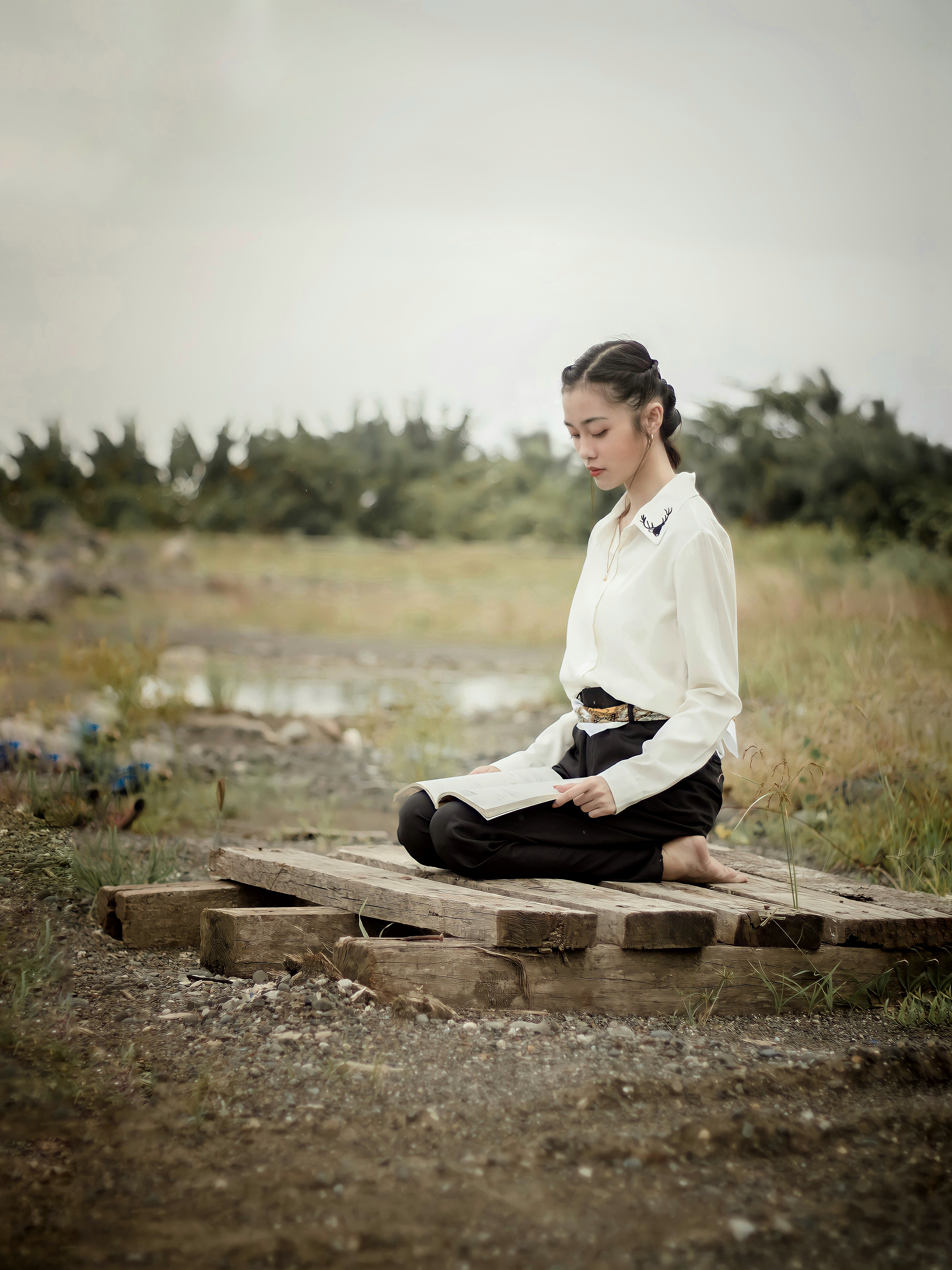 Woman in White Dress Sitting on a Bench · Free Stock Photo