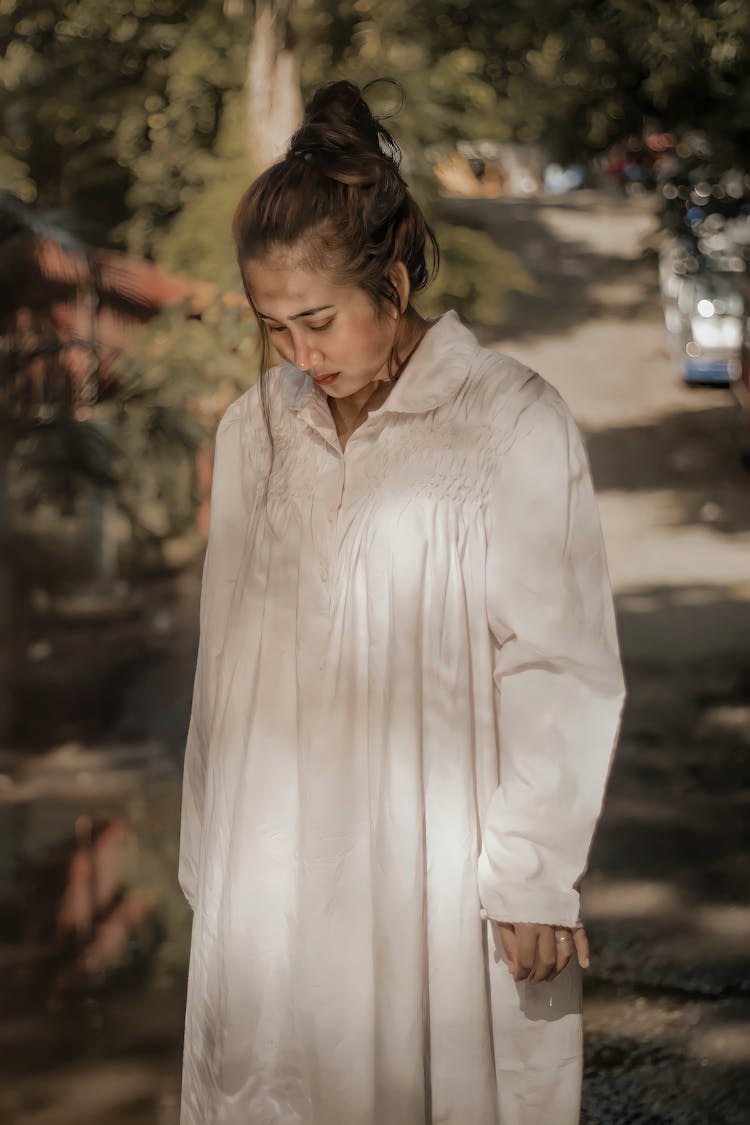 A Woman Wearing A White Night Gown