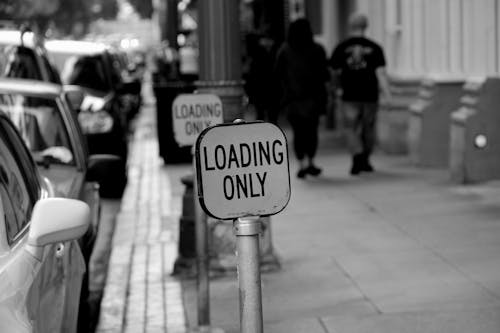 Black and White Photo of a Road Sign