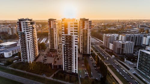 Free High Angle Photography of High-rise Buildings Near Road during Golden Hour Stock Photo