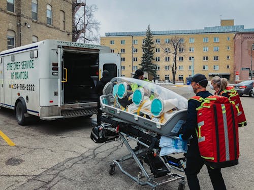 Paramedics with Medical Transportation on Street