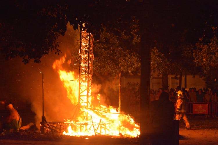 People Watching The Bonfires Of Saint John At Alicante, Spain