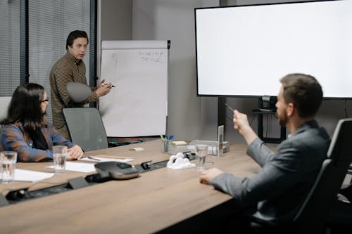 Free Man Presenting at the Meeting Stock Photo