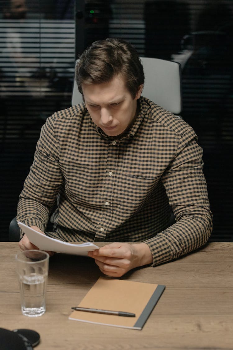 Man Reading A Paper