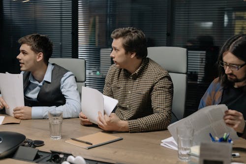 Free Men Holding Documents at the Meeting Stock Photo