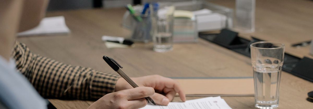 Signing documents at a table