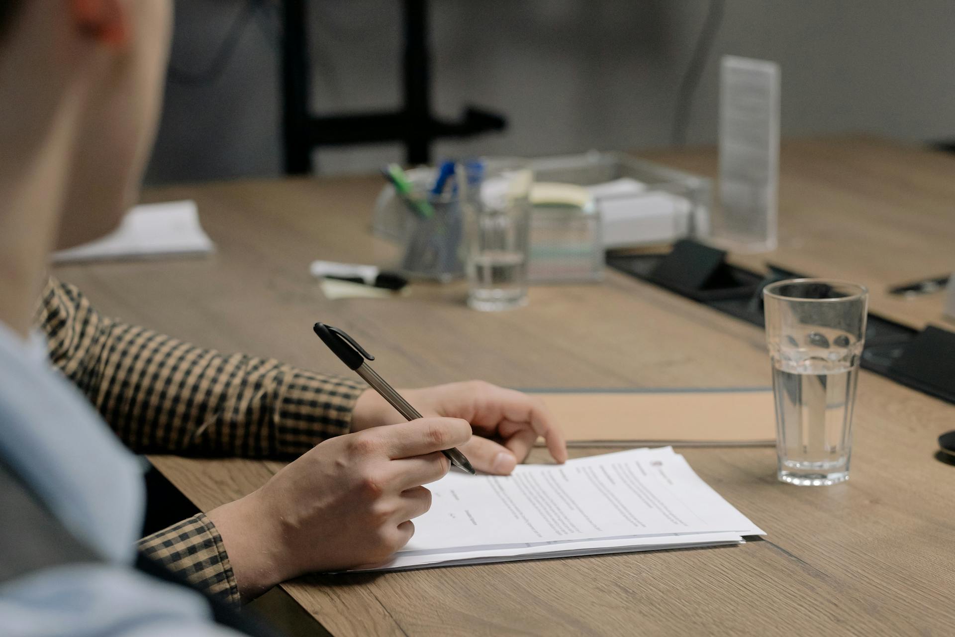 A Person Signing Contract Documents