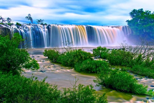 Free Water Falls Surrounding Green Grass during Daytime Stock Photo