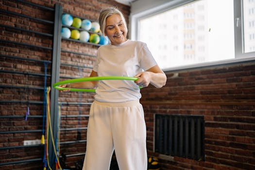 Smiling senior woman exercises with a hula hoop, promoting fitness and fun.