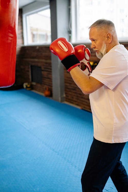 Free An Elderly Man Engaged in Boxing Exercise Stock Photo