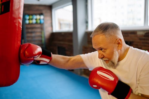 Free A Man Punching the Heavy Bag Stock Photo