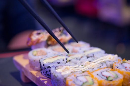 A delicious sushi platter with chopsticks, showcasing a variety of fresh sushi rolls.