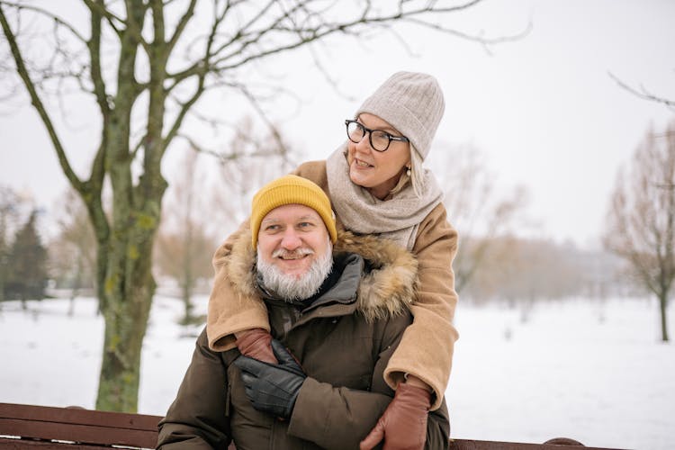 An Elderly Couple In Winter Clothing