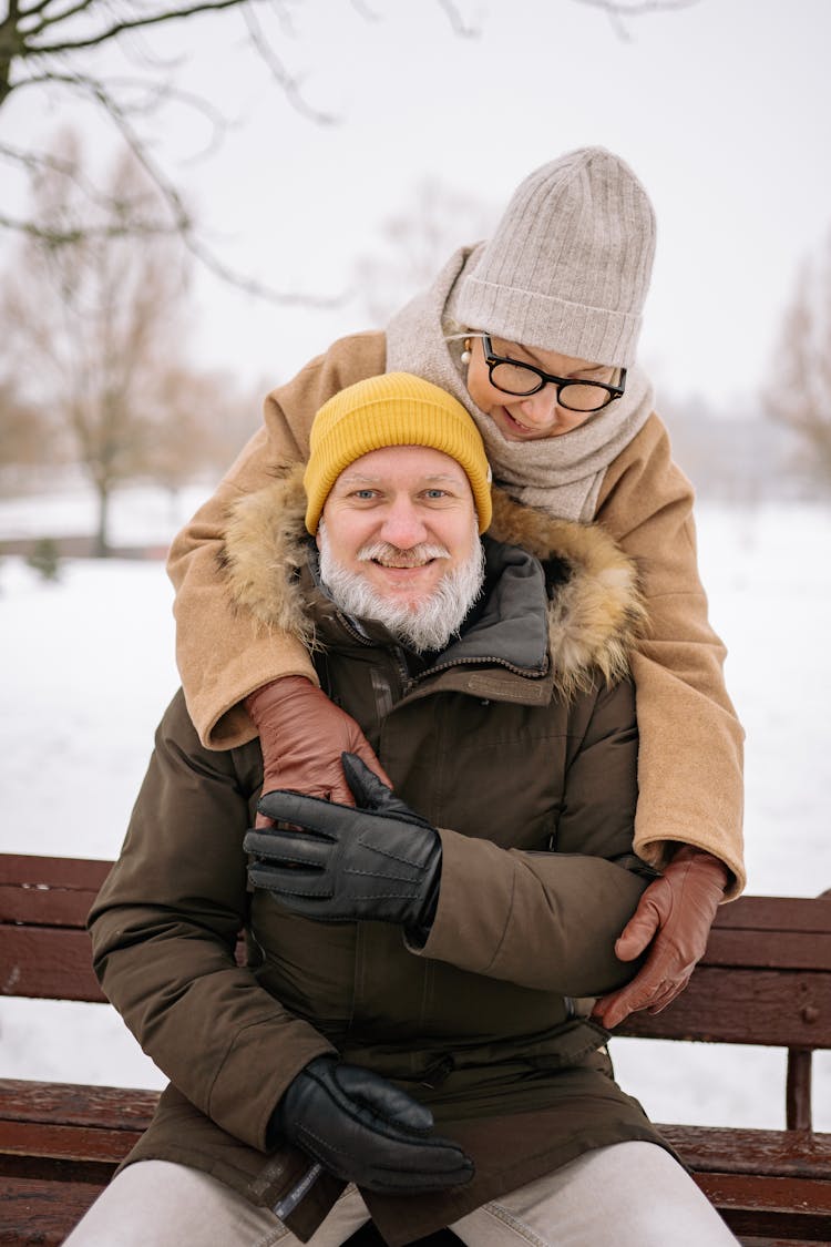 An Elderly Couple In Winter Clothing