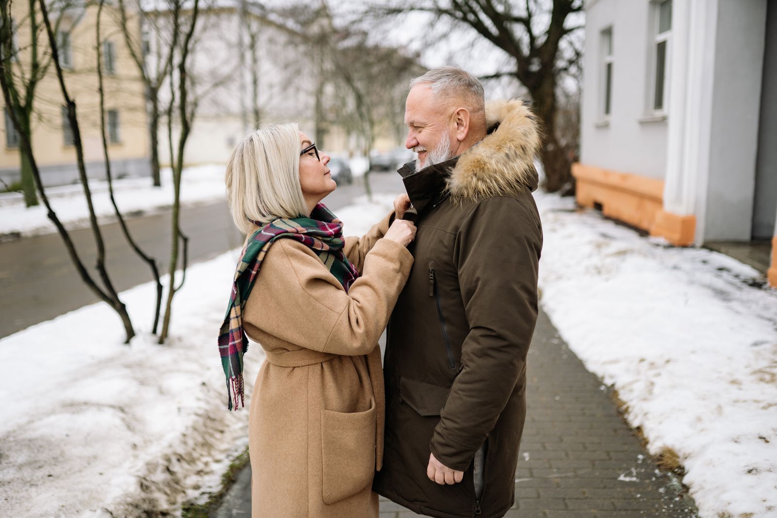 Senior couple enjoying a winter day outdoors in warm coats