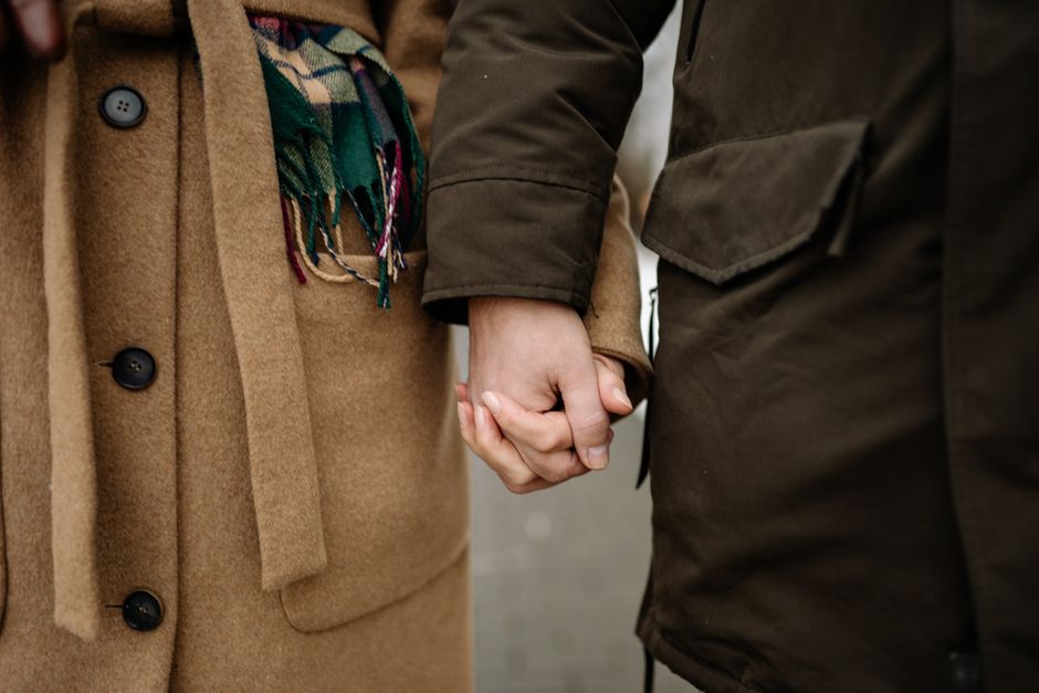 hands holding warm tea cup calm