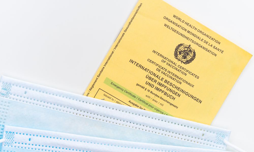 doctor checking yellow fever vaccination certificate