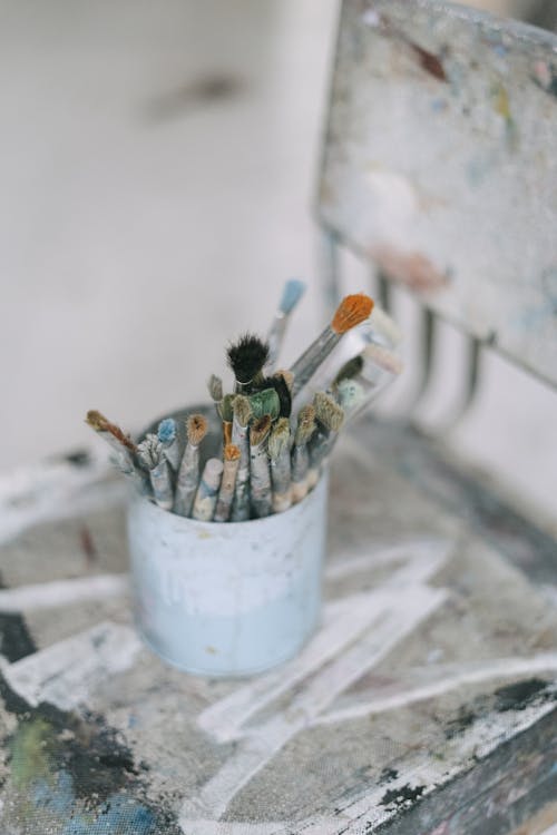 Paint Brushes in White Bucket