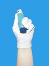 Person Holding White and Blue Plastic Cup