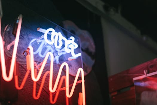 Close-up shot of neon signage featuring red and blue colors, creating a vibrant and modern atmosphere.
