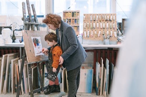 A Boy Learning How to Paint